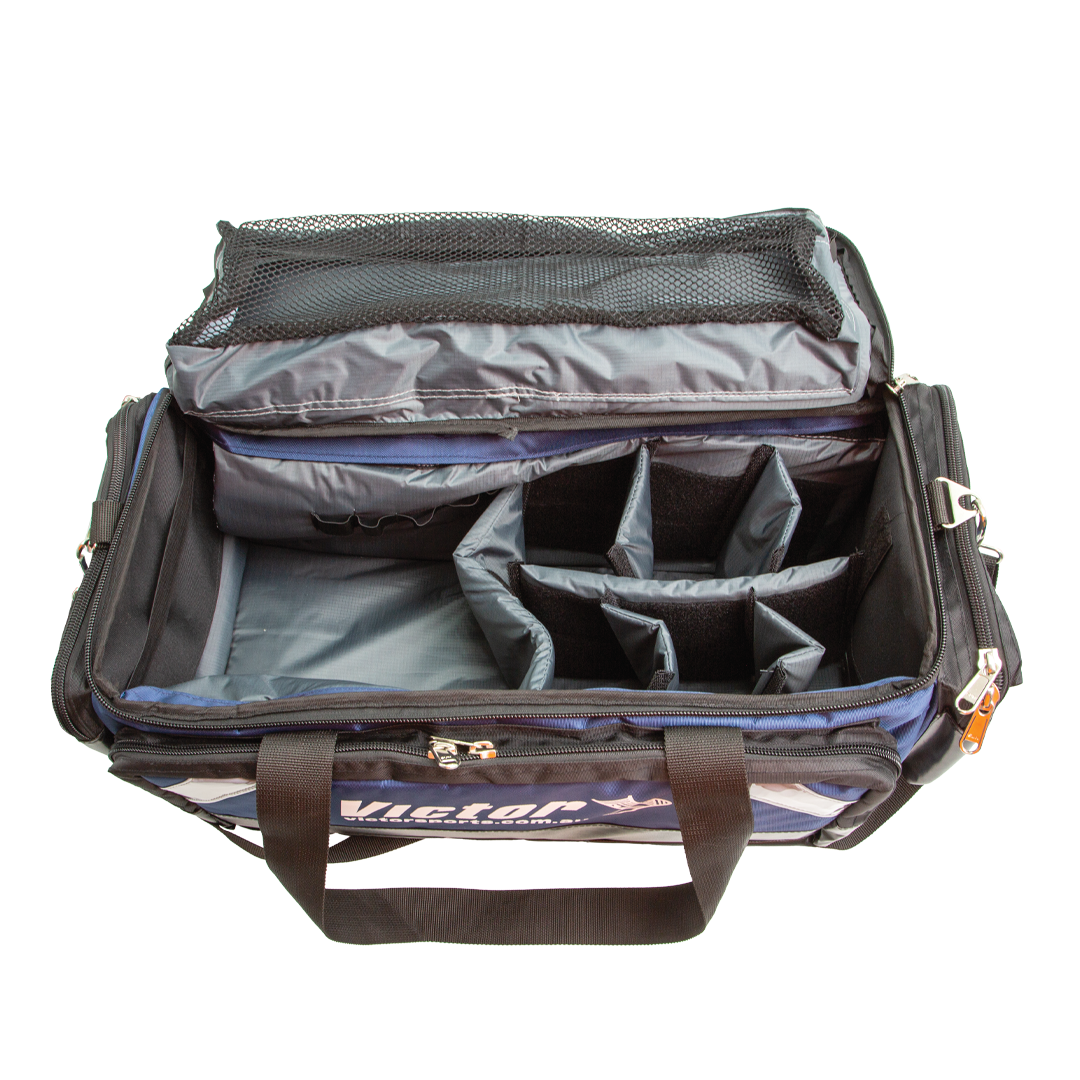 Open travel bag with compartments on a white background